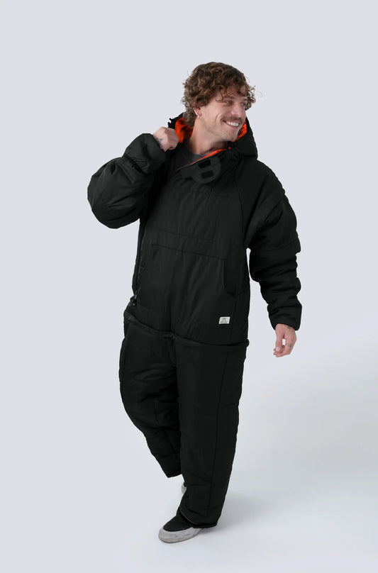 Man wearing the Selk'bag SWYTCH Lite wearable sleeping bag in Cobre Black