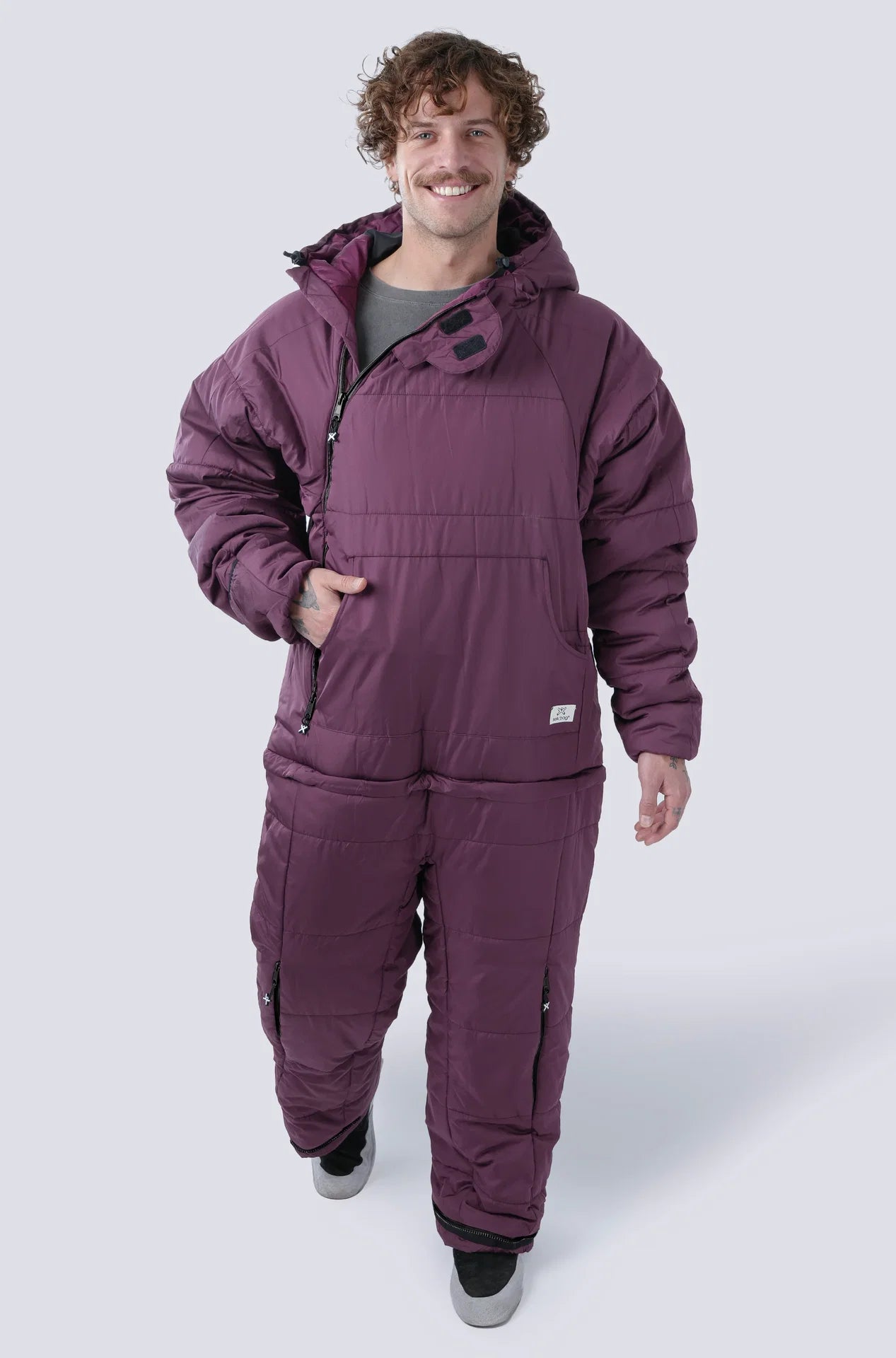 Man wearing the selk'bag wearable sleeping bag