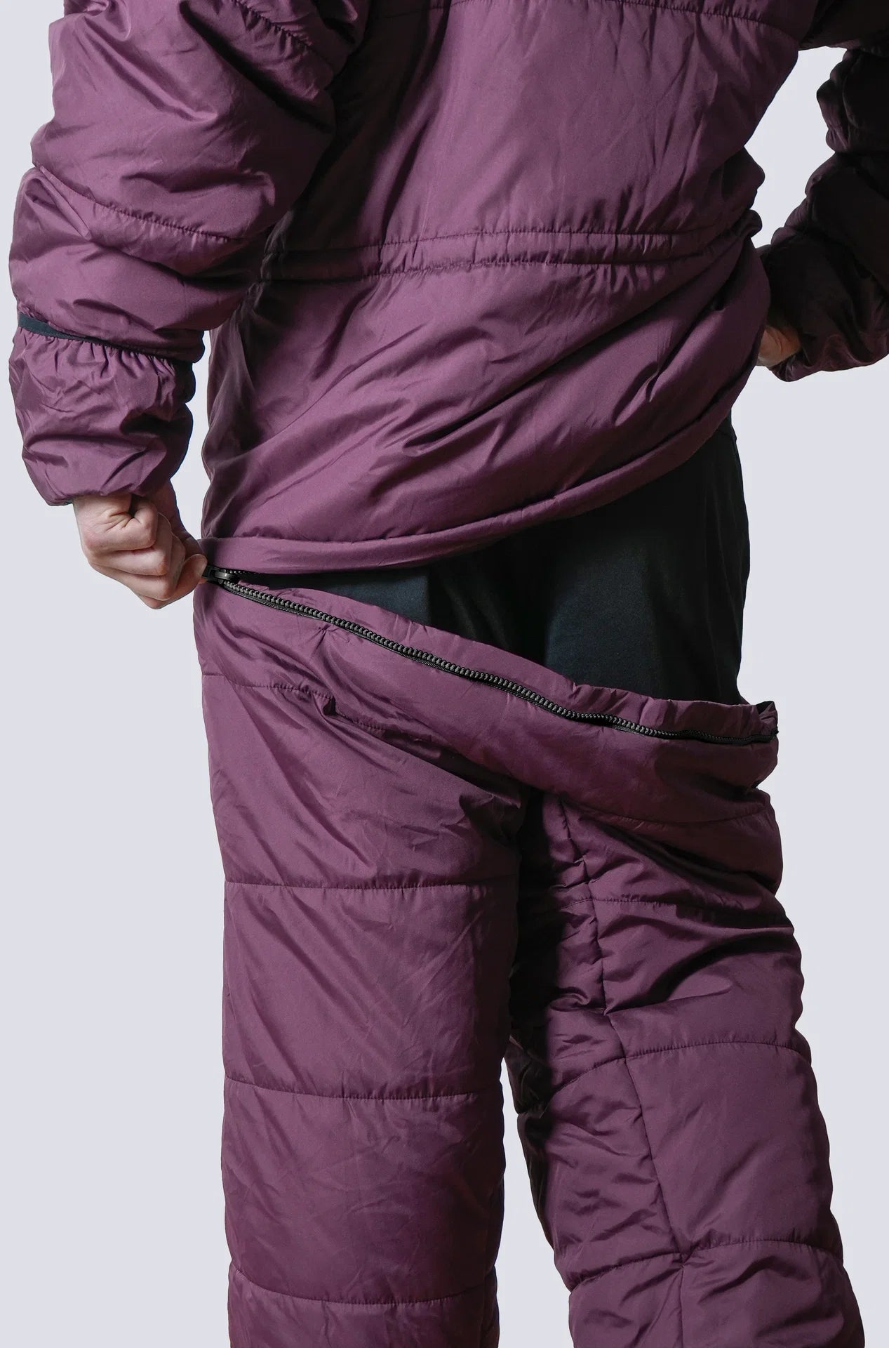 Man wearing the selk'bag wearable sleeping bag
