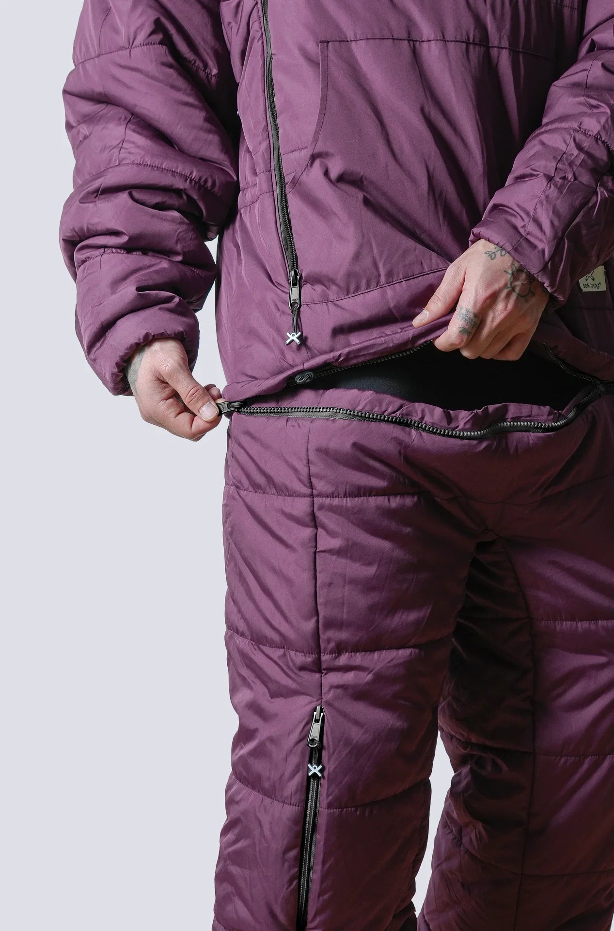 Man wearing the selk'bag wearable sleeping bag