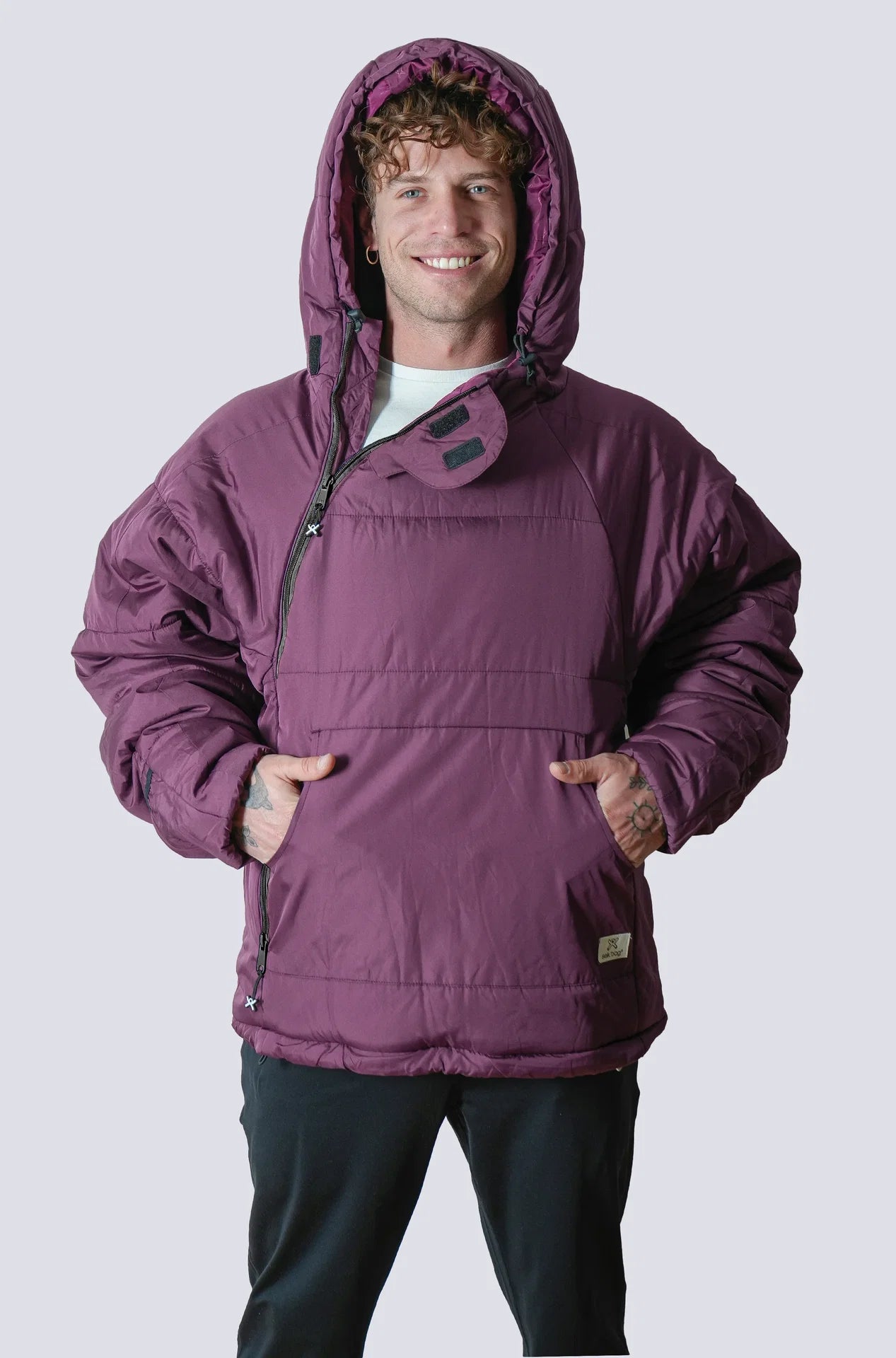 Man wearing the selk'bag wearable sleeping bag