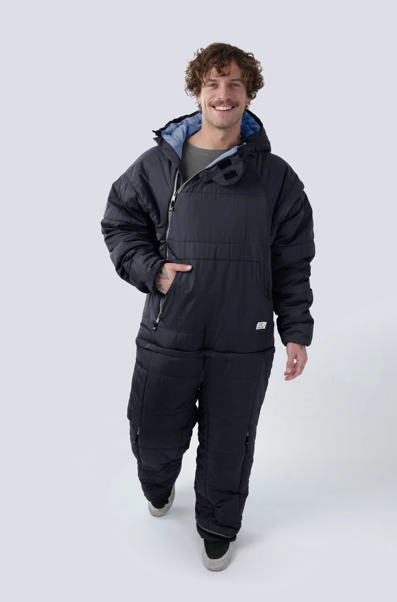 Man wearing the selk'bag wearable sleeping bag